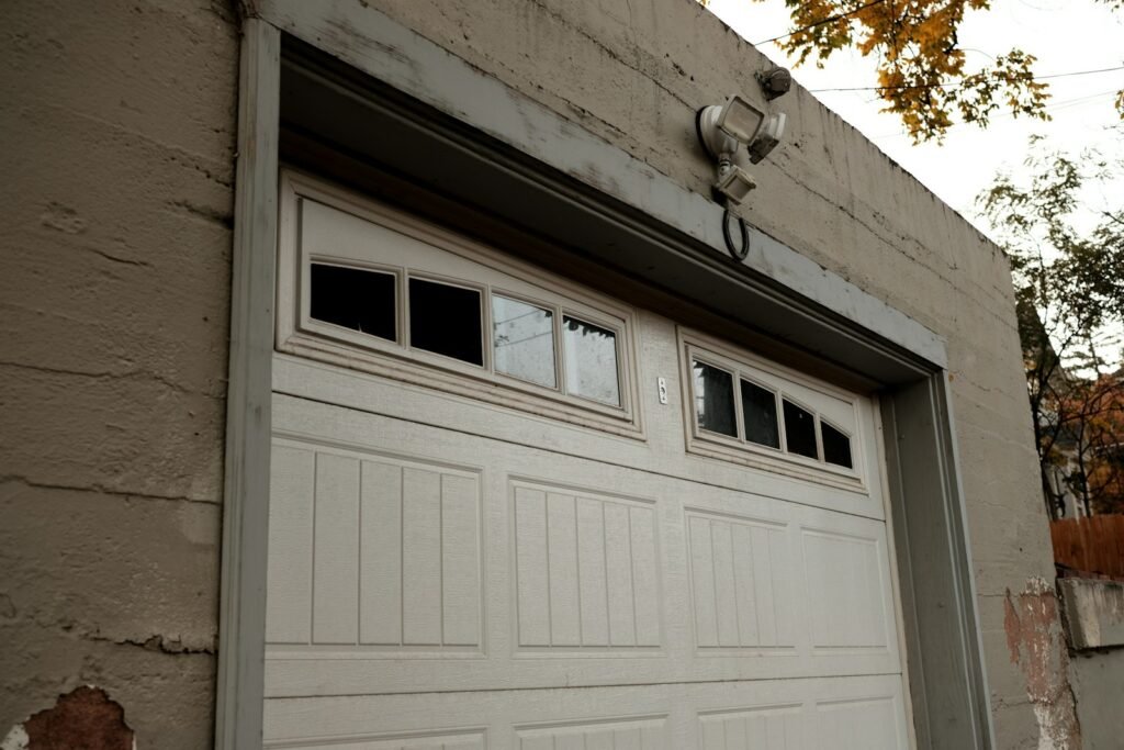 White garage door on brick building
