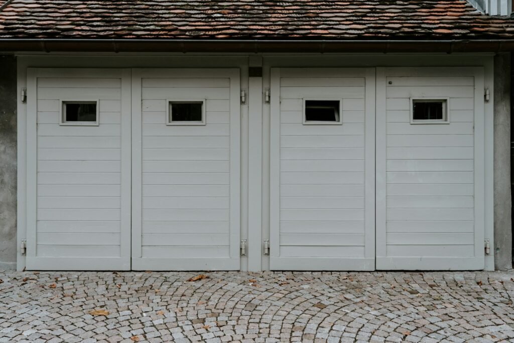 Closed white wooden house garage door