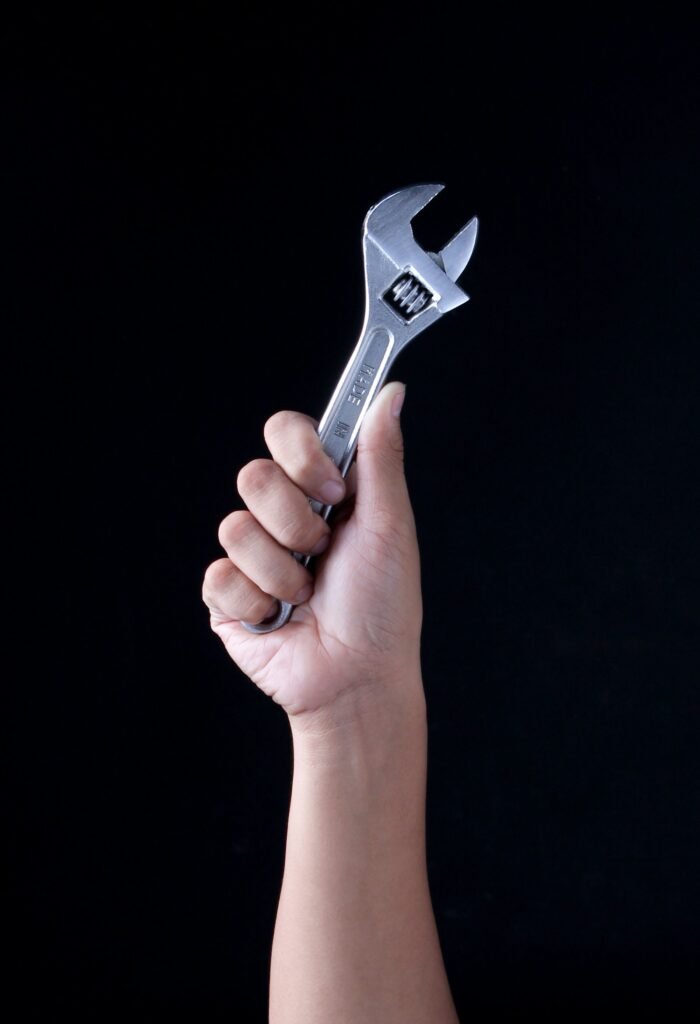 Technician holding metal tool