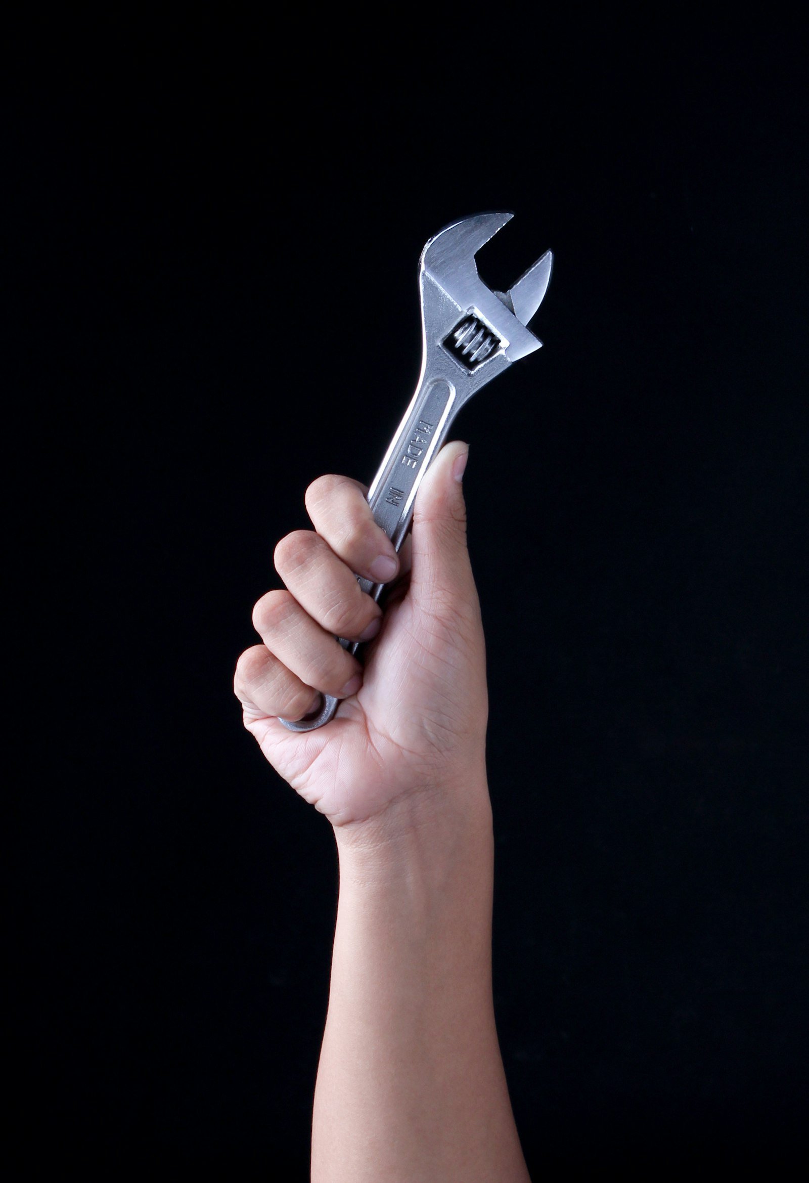 Technician working on garage door spring hardware